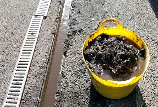 Debris removed from a blocked channel drain